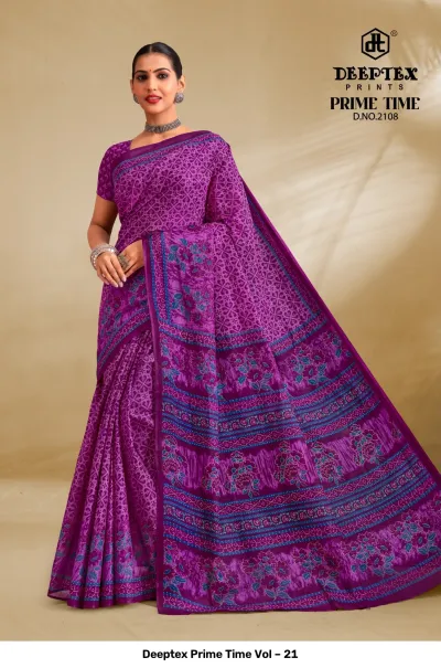 Deeptex Prime Time Vol – 21 purple and blue printed cotton saree featuring traditional geometric and floral motifs.