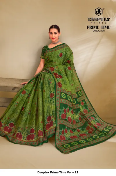 Deeptex Prime Time Vol – 21 green printed cotton saree with red floral patterns and an intricate decorative border.
