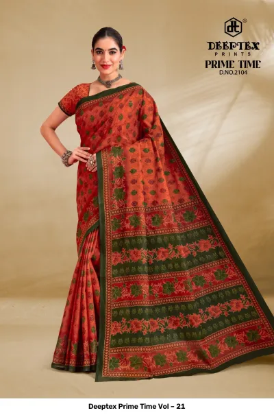 Deeptex Prime Time Vol – 21 rust orange and dark green printed cotton saree with a floral pattern and a geometric border.