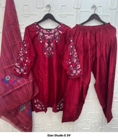 Elan Studio E 59: Maroon salwar suit set including a solid color kurta with intricate floral thread embroidery and a printed dupatta.