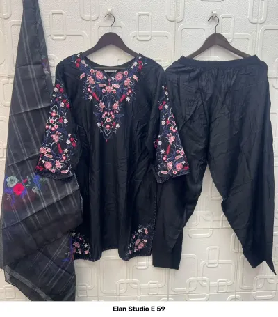 Elan Studio E 59: Black salwar suit featuring a plain kurta with floral thread work on the neckline and sleeves, paired with a patterned dupatta.