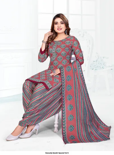 Ganeshji Ajrakh Special Vol 5. A model in a dusty rose salwar suit with green geometric block prints.