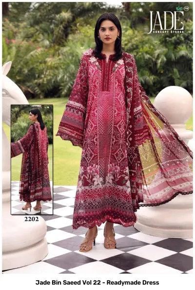 Jade Bin Saeed Vol 22 - Readymade Dress: A woman in a dark maroon patterned cotton dress, featuring detailed floral prints and thread embroidery.