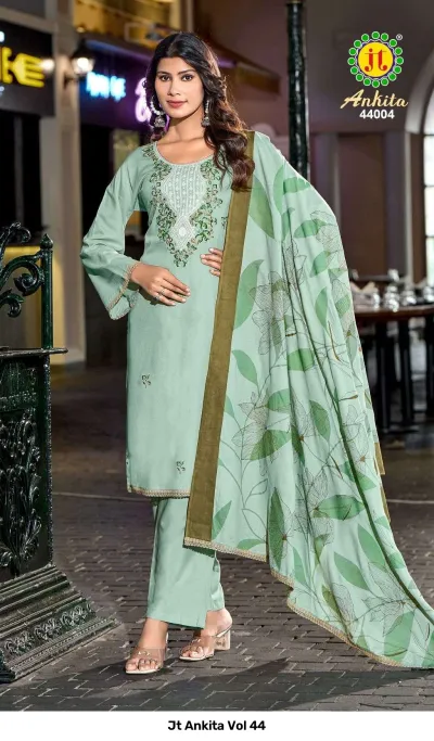 Jt Ankita Vol 44: Mint green salwar suit with a matching floral printed dupatta and detailed thread work embroidery on the neckline.