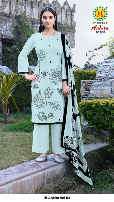 Jt Ankita Vol 51: A model wearing a light green salwar suit with black leaf-patterned thread work and a matching black and green printed dupatta.