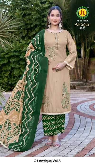 Jt Antique Vol 8: Beige kurti with green floral thread work, paired with green printed palazzo pants and dupatta.