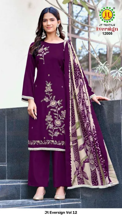 Jt Eversign Vol 12 deep purple dress material with floral thread work embroidery and a matching printed beige and purple dupatta.