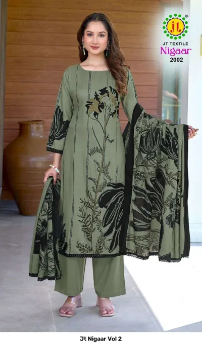 Jt Nigaar Vol 2: Olive green dress material set featuring black floral prints and black lace trim.