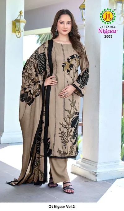 Jt Nigaar Vol 2: Beige dress material set with black floral prints and black lace border detail.
