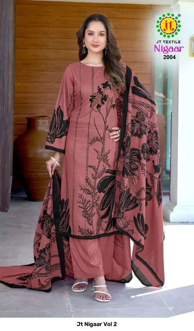Jt Nigaar Vol 2: Mauve dress material set featuring black floral prints and black lace border detail.