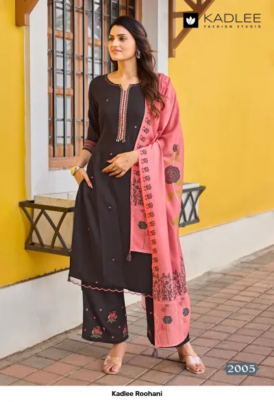 Kadlee Roohani, dark brown salwar suit with thread work detail on the neckline, floral embroidery, and a pink dupatta with floral print.