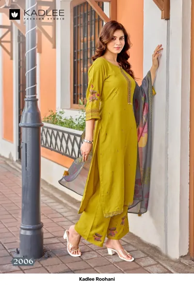 Kadlee Roohani, olive green straight cut salwar suit with thread work on neckline, floral embroidered hem, and a printed grey dupatta.