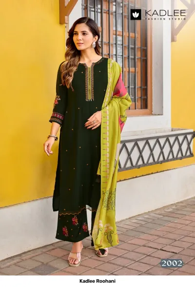 Kadlee Roohani, dark green straight cut salwar suit with thread work neckline, floral embroidery on sleeve and hem, and a yellow printed dupatta.