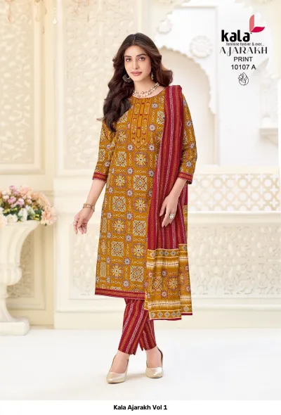 Kala Ajarakh Vol 1, mustard yellow salwar suit with geometric Ajarakh print and a maroon dupatta.