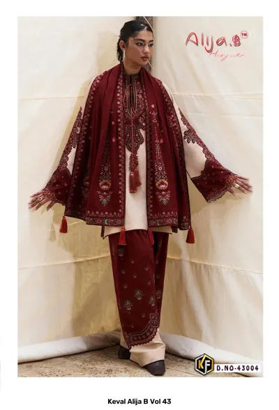 Keval Alija B Vol 43, beige and maroon cotton salwar suit featuring heavy thread work embroidery and tassel detailing with dupatta.