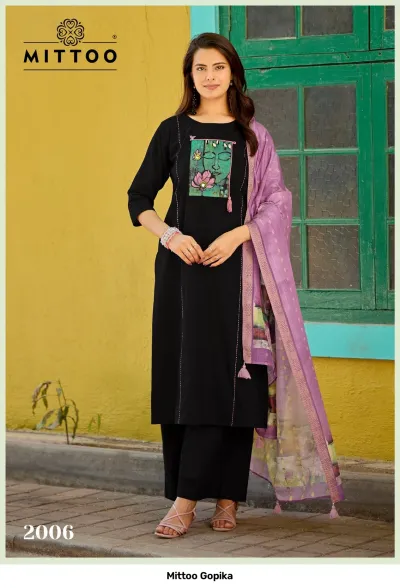 Mittoo Gopika: Purple kurti and palazzo set with a colorful printed chest patch and a patterned, sheer dupatta.