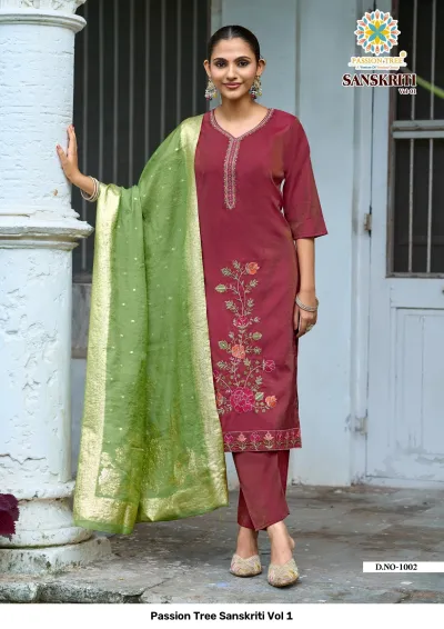 Passion Tree Sanskriti Vol 1: Maroon salwar suit featuring floral thread embroidery, plain pants, and a green zari work dupatta.