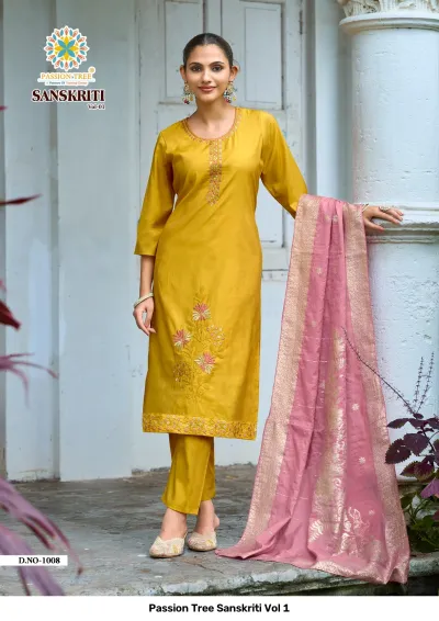 Passion Tree Sanskriti Vol 1: Mustard yellow salwar suit with floral thread embroidery, matching pants, and a pink zari work dupatta.