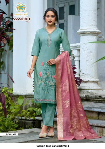 Passion Tree Sanskriti Vol 1: Teal green salwar suit featuring floral thread embroidery, matching pants, and a pink zari work dupatta.