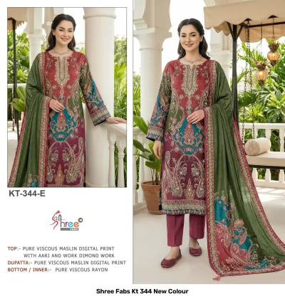 Shree Fabs Kt 344 New Colour: burgundy and green printed kurti with thread and stone-style work, paired with a matching green dupatta.