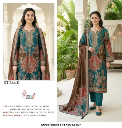 Shree Fabs Kt 344 New Colour: teal and rust printed kurti with intricate thread work and a coordinated brown printed dupatta.