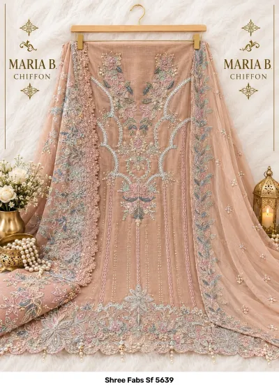 Shree Fabs Sf 5639: Peach chiffon dress material featuring floral embroidery, detailed thread work, and pearl embellishments displayed on a hanger.