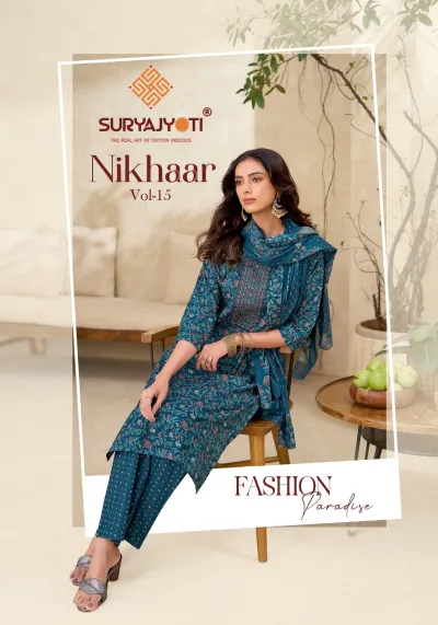 Suryajyoti Nikhaar Vol 15, teal printed cotton salwar suit with floral patterns and neck thread work, including matching dupatta and bottom.