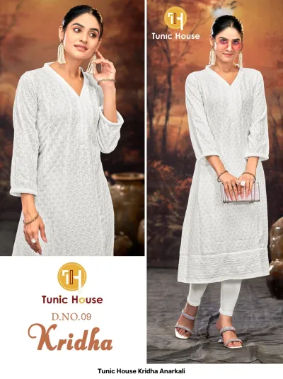 Tunic House Kridha Anarkali: White kurti adorned with intricate thread embroidery and sequin work, V-neck, three-quarter sleeves, worn with white leggings.