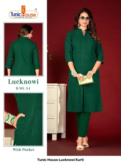 Tunic House Lucknowi Kurti: Dark green kurti with matching trousers, featuring tonal thread work, a side pocket, and a button-down placket.