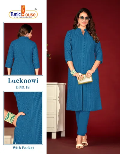 Tunic House Lucknowi Kurti: Blue kurti with matching trousers, featuring tonal thread work, a side pocket, and a button-down placket.