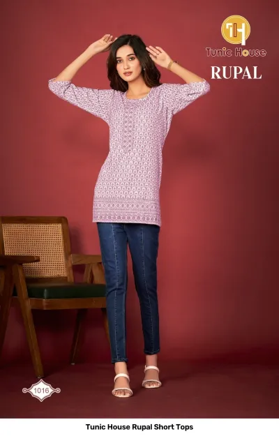 Tunic House Rupal Short Tops 1016: A model wears a light purple printed cotton kurti top paired with blue jeans.