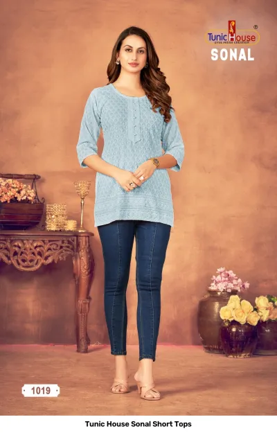 Tunic House Sonal Short Tops, light blue kurti with thread work and button detail.