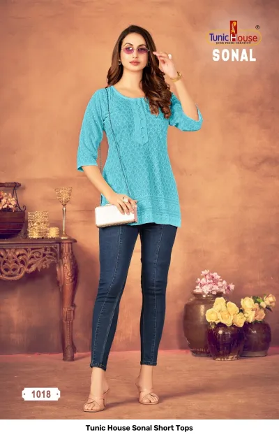 Tunic House Sonal Short Tops, turquoise kurti with thread work and button detail.