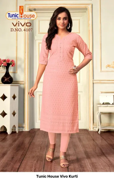 Tunic House Vivo Kurti D.NO. 4107 peach straight cut kurti with all-over chikankari embroidery and sequin embellishments.