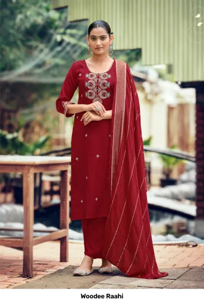 Woodee Raahi: Deep red salwar suit with floral mirror work embroidery on the chest, matching straight-cut pants, and a zari-bordered dupatta.