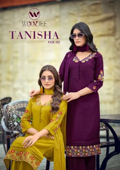 Woodee Tanisha Vol 2 catalog cover showing models in mustard yellow and purple salwar suits with floral embroidery and button embellishments.