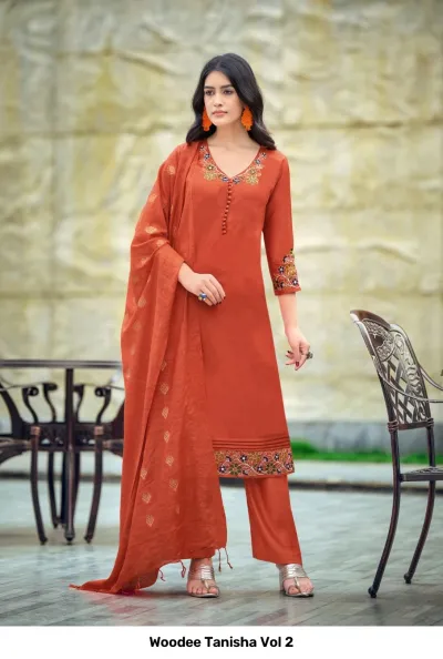 Woodee Tanisha Vol 2 orange salwar suit with floral thread work at the neckline, cuffs, and hem, including a matching dupatta and pants.