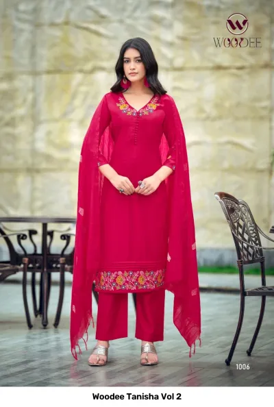Woodee Tanisha Vol 2 magenta pink salwar suit featuring floral thread work at the neckline and hem, with a matching dupatta and pants.