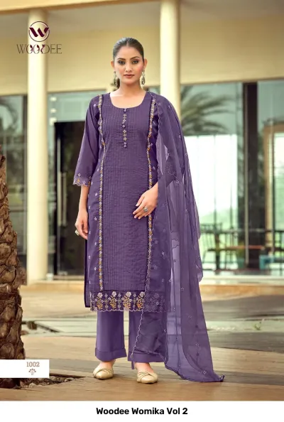Woodee Womika Vol 2: Purple salwar suit with straight-cut kurti, palazzo pants, and matching dupatta, featuring vertical thread work and embroidered hem.