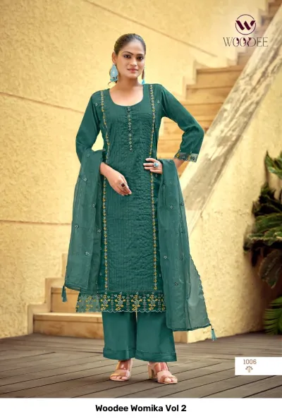 Woodee Womika Vol 2: Dark teal salwar suit with straight-cut kurti, palazzo pants, and matching sheer dupatta, featuring detailed thread work.