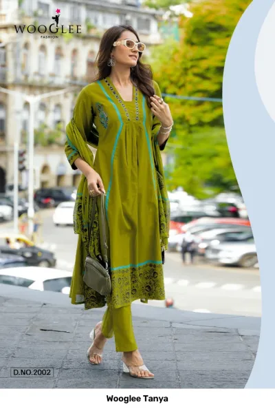 Wooglee Tanya D.No.2002: An olive green salwar suit featuring printed patterns, thread work, and a matching printed dupatta.