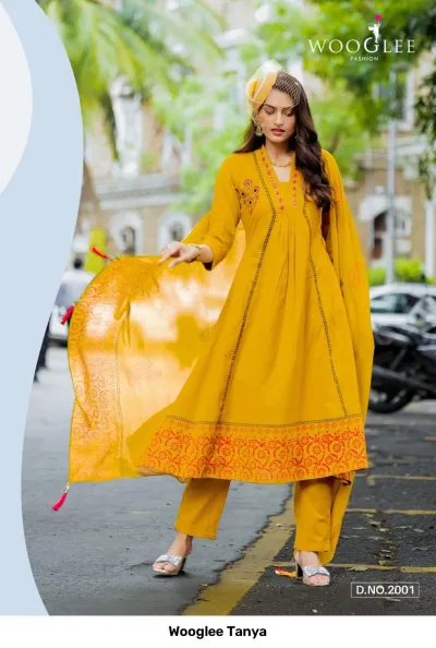 Wooglee Tanya D.No.2001: A yellow salwar suit with embroidered thread work details, printed hemline, and a matching dupatta.
