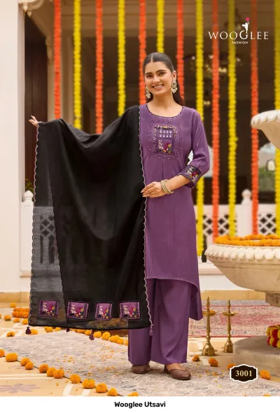 Wooglee Utsavi 3001: Purple solid salwar suit with high-low kurti, embroidered chest detail, and contrasting black dupatta.