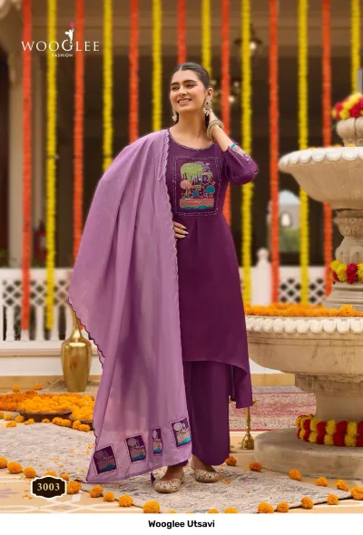 Wooglee Utsavi 3003: Dark purple solid salwar suit with high-low kurti, embroidered neck patch, and lavender dupatta.