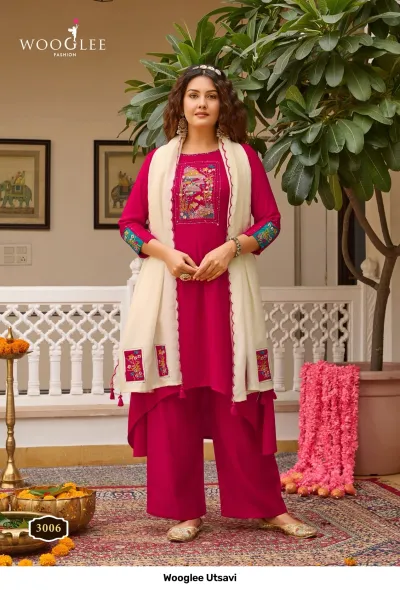 Wooglee Utsavi 3006: Hot pink solid salwar suit with high-low kurti, embroidered chest patch, and cream-colored dupatta.