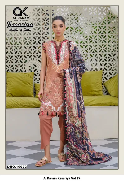 Al Karam Kesariya Vol 19 peach and dark blue printed lawn salwar suit featuring a long kurti, solid trousers, and detailed hem, DNO 19002.