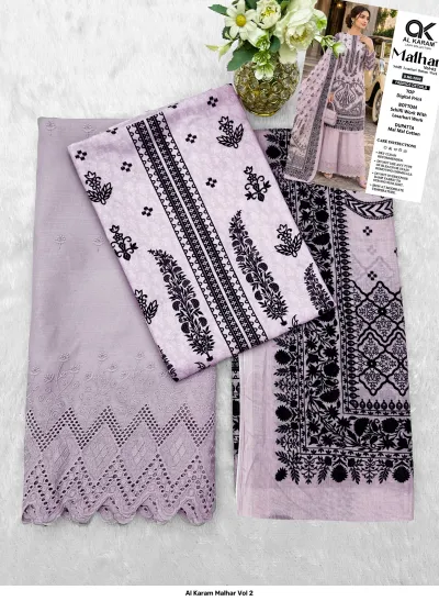 Al Karam Malhar Vol 2: Flat lay of light purple salwar suit fabric, digital print top, schifli bottom work, and printed dupatta.
