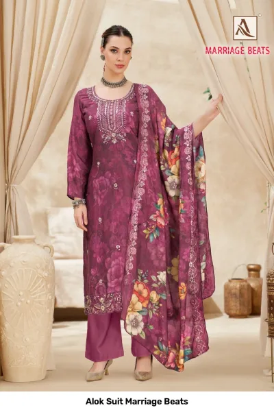 Alok Suit Marriage Beats: Purple floral printed salwar suit with decorative neckline embroidery and a matching printed dupatta with floral motifs.