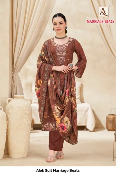 Alok Suit Marriage Beats: Brown floral printed salwar suit with detailed embroidery on the neckline and a matching printed dupatta.
