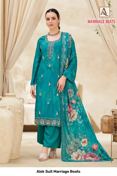 Alok Suit Marriage Beats: Teal salwar suit with floral motifs, subtle neckline embroidery, and a matching floral printed dupatta.
